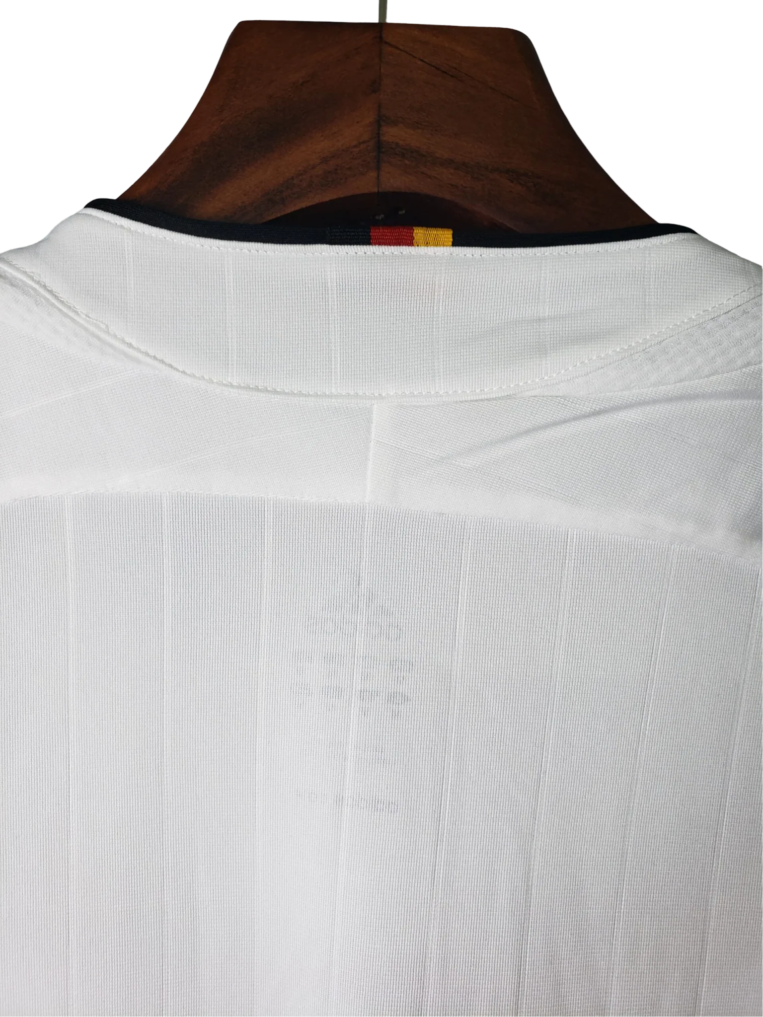 https://cdn.shopify.com/s/files/1/0826/7228/8075/files/2006-germany-world-cup-retro-kit-821318.webp?v=1741197028
