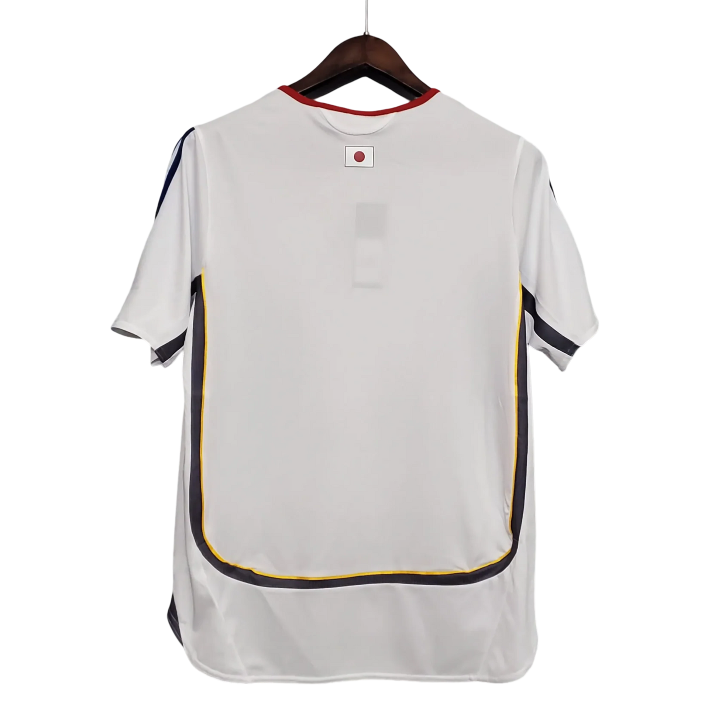 https://cdn.shopify.com/s/files/1/0826/7228/8075/files/2006-japan-away-retro-kit-391279.webp?v=1741197171