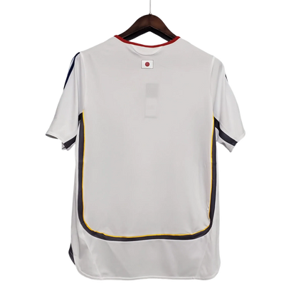 https://cdn.shopify.com/s/files/1/0826/7228/8075/files/2006-japan-away-retro-kit-391279.webp?v=1741197171