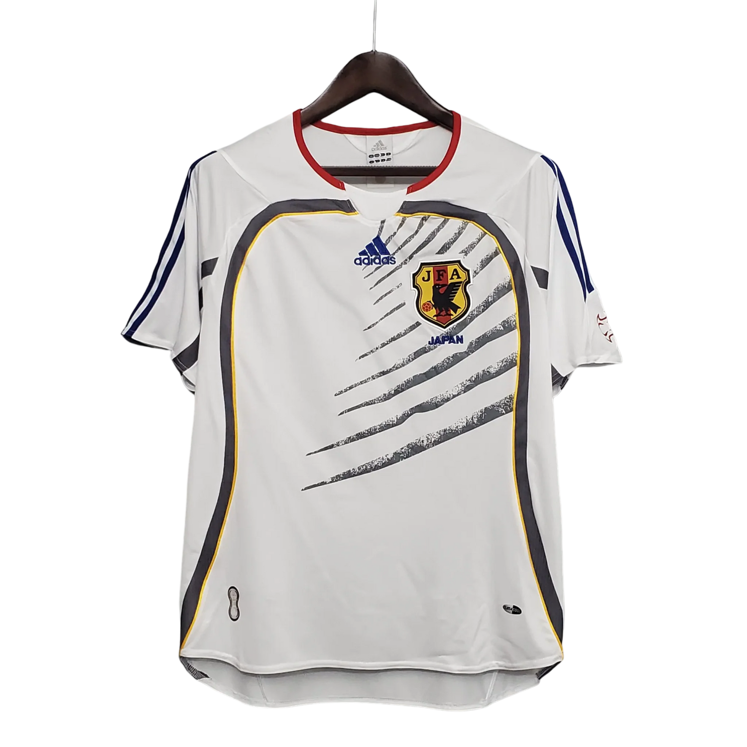 https://cdn.shopify.com/s/files/1/0826/7228/8075/files/2006-japan-away-retro-kit-411679.webp?v=1741197170