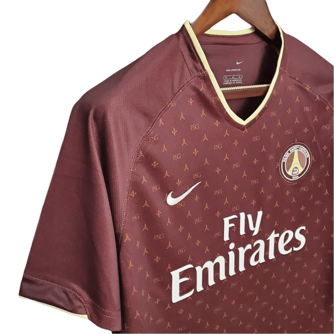 https://cdn.shopify.com/s/files/1/0826/7228/8075/files/20062007-paris-saint-germain-fly-emirates-away-red-retro-jersey-210261.webp?v=1741197865