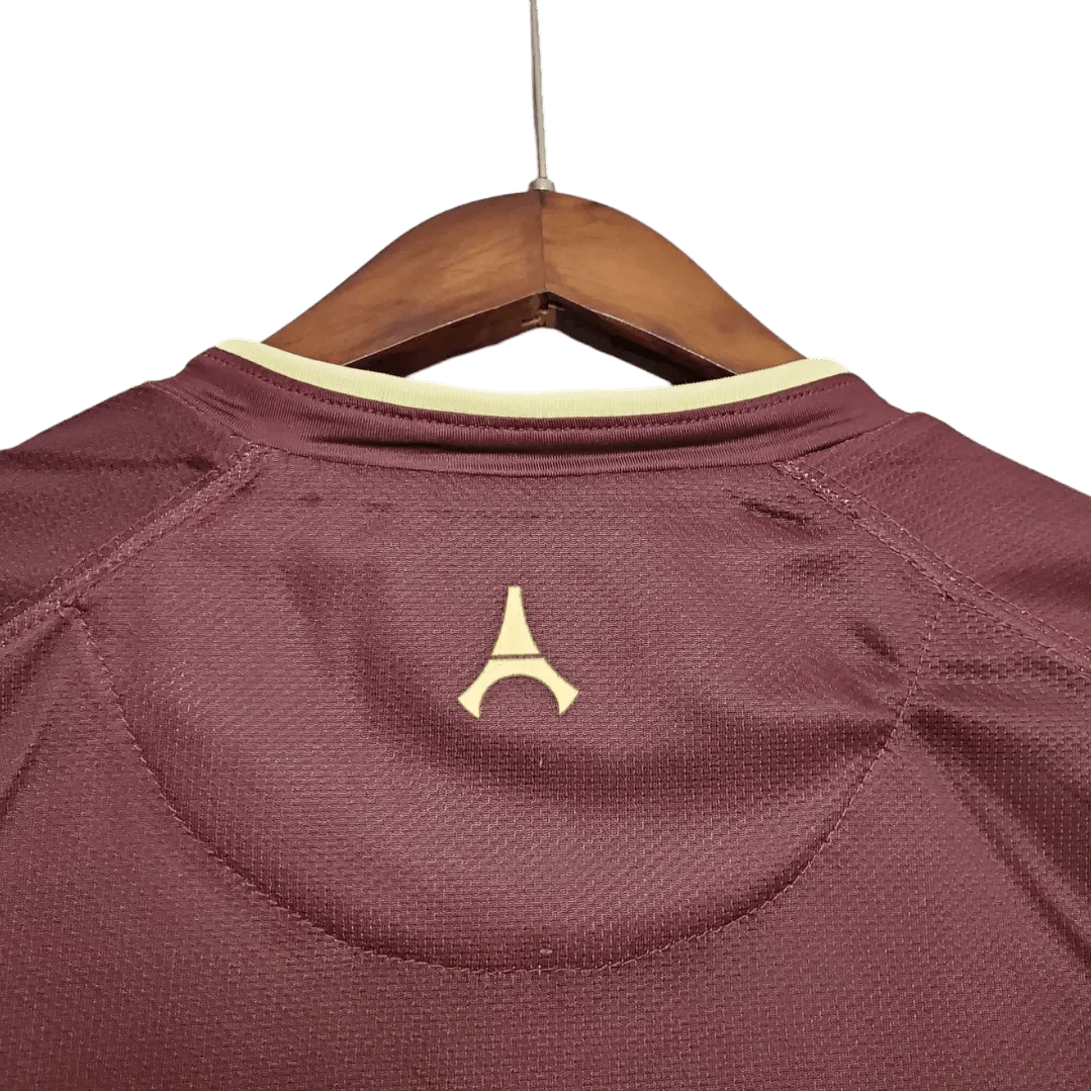 https://cdn.shopify.com/s/files/1/0826/7228/8075/files/20062007-paris-saint-germain-fly-emirates-away-red-retro-jersey-298126.webp?v=1741197866
