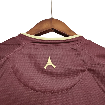 https://cdn.shopify.com/s/files/1/0826/7228/8075/files/20062007-paris-saint-germain-fly-emirates-away-red-retro-jersey-298126.webp?v=1741197866