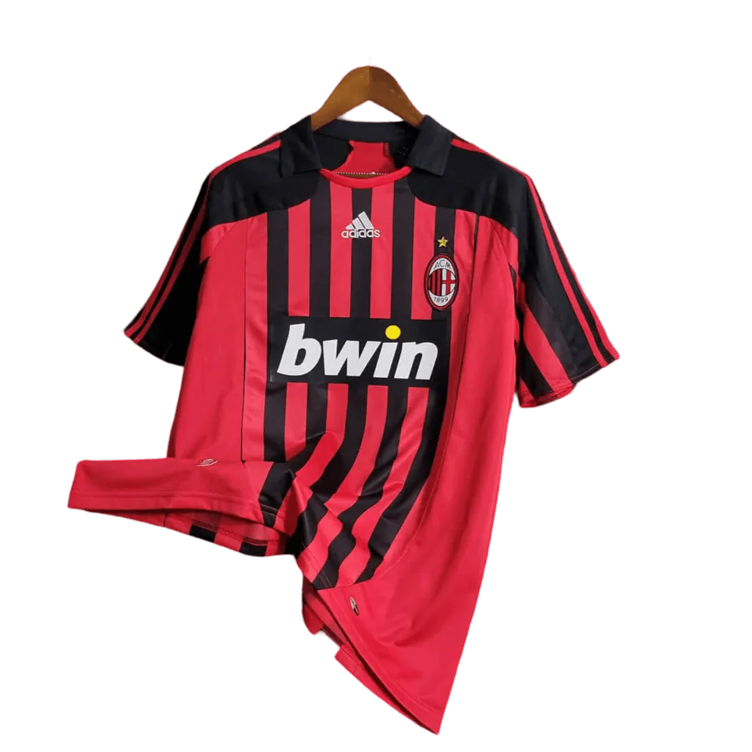 https://cdn.shopify.com/s/files/1/0826/7228/8075/files/20072008-ac-milan-bwin-home-retro-kit-489497.webp?v=1741197274