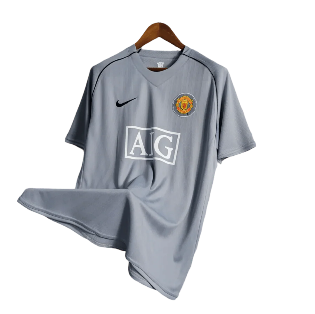 https://cdn.shopify.com/s/files/1/0826/7228/8075/files/20072008-manchester-united-aig-home-gray-goalkeeper-retro-kit-classickits433-504846.webp?v=1741197549