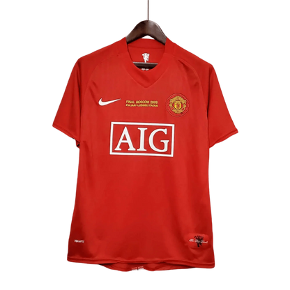 https://cdn.shopify.com/s/files/1/0826/7228/8075/files/20072009-manchester-united-aig-home-retro-kit-classickits433-279399.webp?v=1741197754