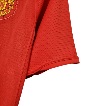 https://cdn.shopify.com/s/files/1/0826/7228/8075/files/20072009-manchester-united-aig-home-retro-kit-classickits433-901457.webp?v=1741197754