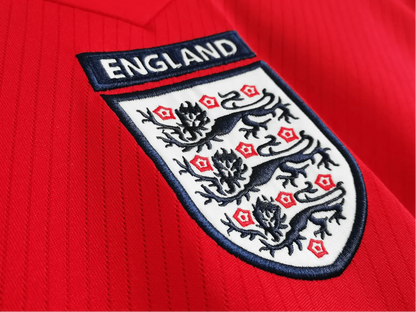 https://cdn.shopify.com/s/files/1/0826/7228/8075/files/2008-england-away-red-retro-kit-162688.webp?v=1741196953