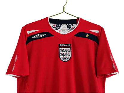 https://cdn.shopify.com/s/files/1/0826/7228/8075/files/2008-england-away-red-retro-kit-576549.webp?v=1741196949