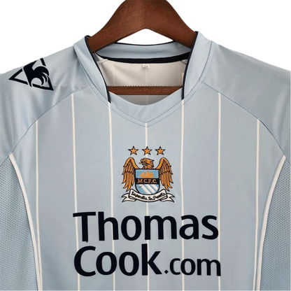 https://cdn.shopify.com/s/files/1/0826/7228/8075/files/20082009-manchester-city-thomas-cook-home-retro-kit-classickits433-317096.webp?v=1741198270