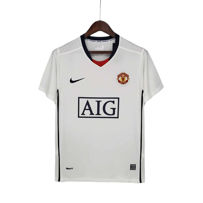 https://cdn.shopify.com/s/files/1/0826/7228/8075/files/20082009-manchester-united-aig-away-white-league-edition-retro-kit-classickits433-612549.webp?v=1741197622