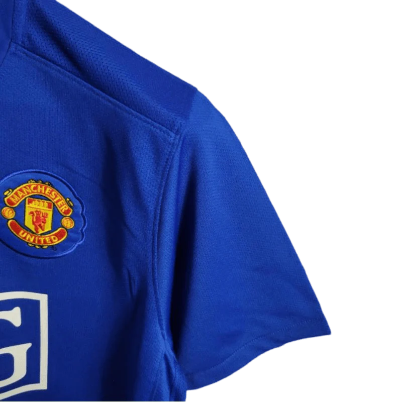 https://cdn.shopify.com/s/files/1/0826/7228/8075/files/20082009-manchester-united-aig-blue-third-retro-kit-classickits433-100477.webp?v=1741198442