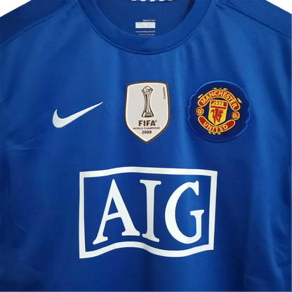 https://cdn.shopify.com/s/files/1/0826/7228/8075/files/20082009-manchester-united-aig-blue-third-retro-kit-classickits433-128747.webp?v=1741197748