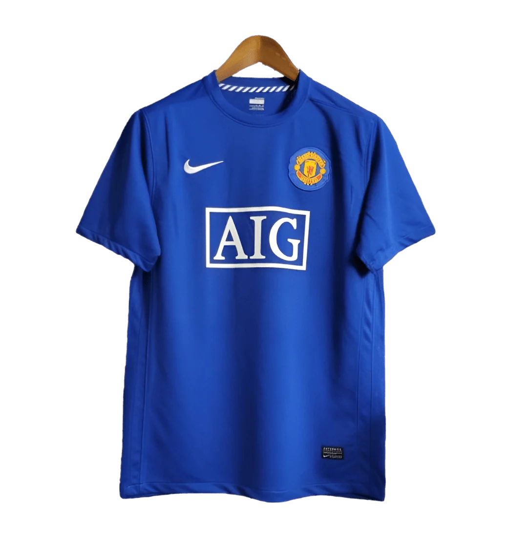 https://cdn.shopify.com/s/files/1/0826/7228/8075/files/20082009-manchester-united-aig-blue-third-retro-kit-classickits433-196423.webp?v=1741198443