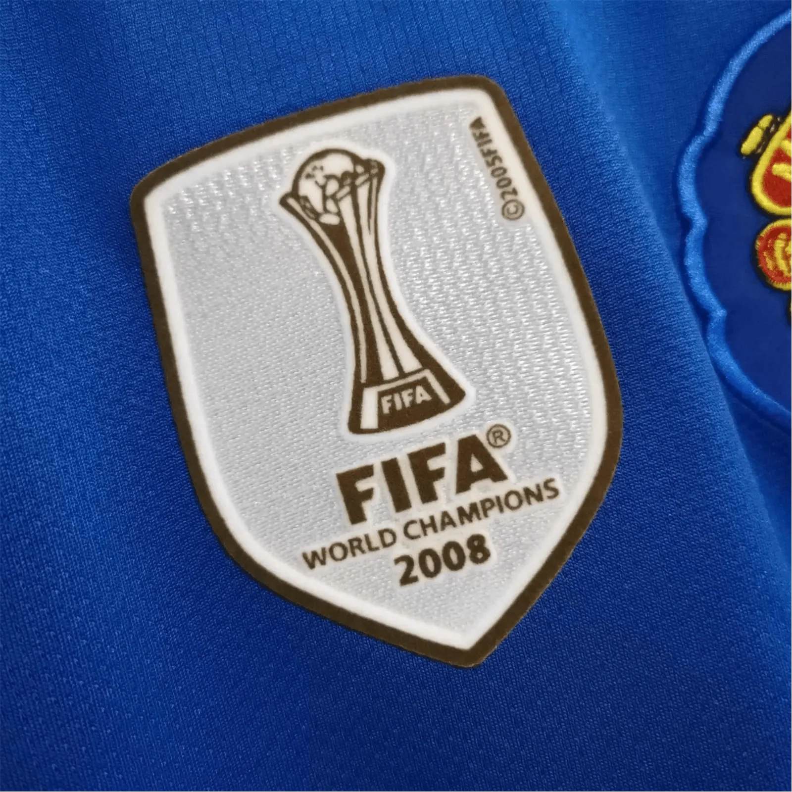 https://cdn.shopify.com/s/files/1/0826/7228/8075/files/20082009-manchester-united-aig-blue-third-retro-kit-classickits433-303570.webp?v=1741197747