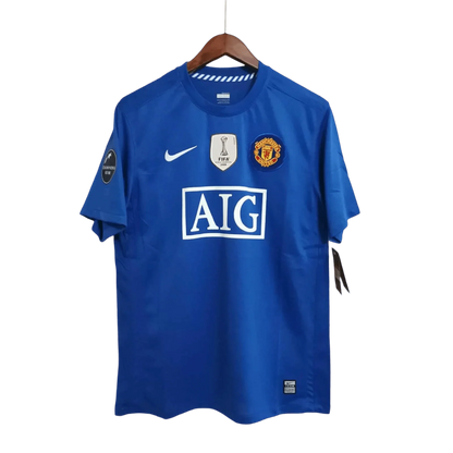 https://cdn.shopify.com/s/files/1/0826/7228/8075/files/20082009-manchester-united-aig-blue-third-retro-kit-classickits433-770389.webp?v=1741197748