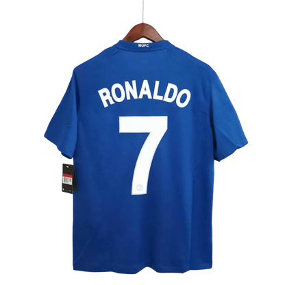 https://cdn.shopify.com/s/files/1/0826/7228/8075/files/20082009-manchester-united-aig-blue-third-retro-kit-classickits433-808957.webp?v=1741197750