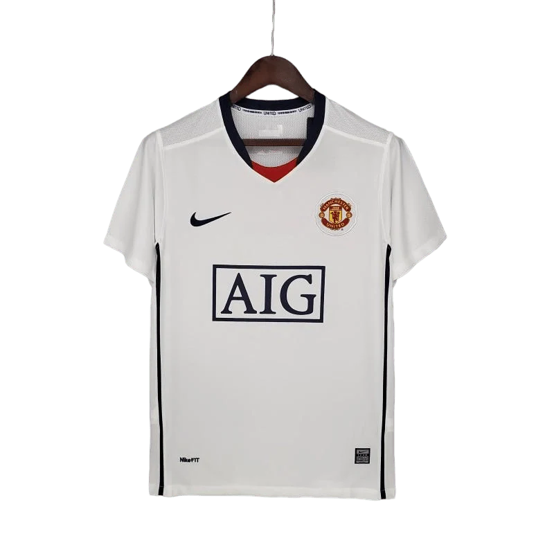 https://cdn.shopify.com/s/files/1/0826/7228/8075/files/20082009-manchester-united-aig-white-away-retro-kit-classickits433-439379.webp?v=1741198472