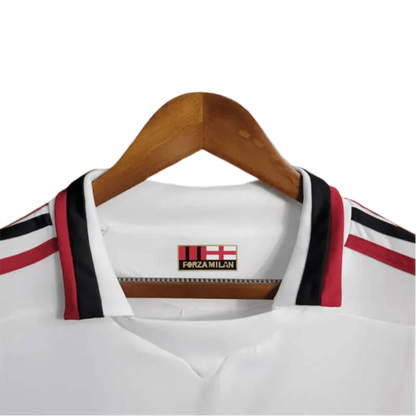 https://cdn.shopify.com/s/files/1/0826/7228/8075/files/20092010-ac-milan-bwin-away-retro-kit-short-sleeves-716539.webp?v=1741197275