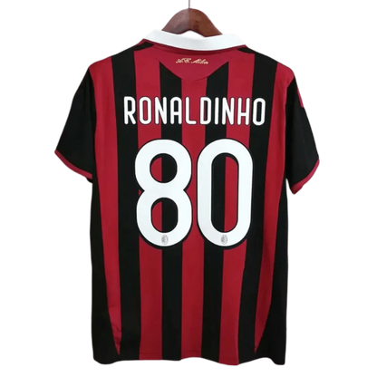 https://cdn.shopify.com/s/files/1/0826/7228/8075/files/20092010-ac-milan-bwin-home-kit-short-sleeves-158112.webp?v=1741197282