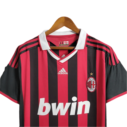 https://cdn.shopify.com/s/files/1/0826/7228/8075/files/20092010-ac-milan-bwin-home-kit-short-sleeves-632197.webp?v=1741197285