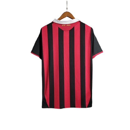 https://cdn.shopify.com/s/files/1/0826/7228/8075/files/20092010-ac-milan-bwin-home-kit-short-sleeves-655307.webp?v=1741197283