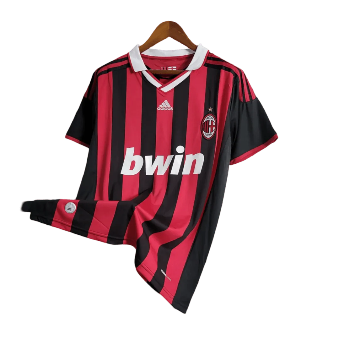 https://cdn.shopify.com/s/files/1/0826/7228/8075/files/20092010-ac-milan-bwin-home-kit-short-sleeves-813300.webp?v=1741197286