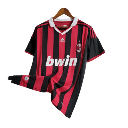 https://cdn.shopify.com/s/files/1/0826/7228/8075/files/20092010-ac-milan-bwin-home-kit-short-sleeves-813300.webp?v=1741197286