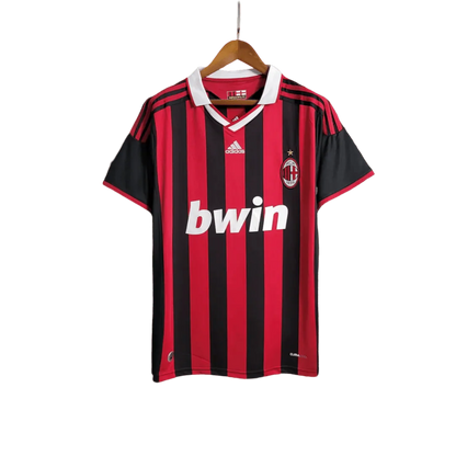 https://cdn.shopify.com/s/files/1/0826/7228/8075/files/20092010-ac-milan-bwin-home-kit-short-sleeves-821870.webp?v=1741197283