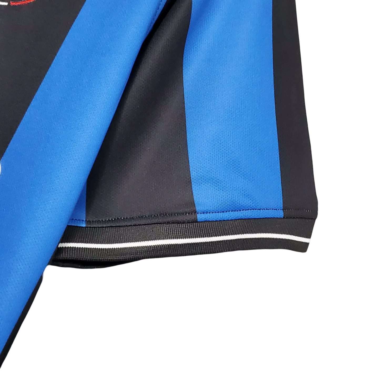 https://cdn.shopify.com/s/files/1/0826/7228/8075/files/20092010-inter-milan-pirelli-home-retro-kit-ucl-final-423192.webp?v=1741197554