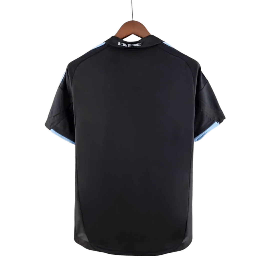 https://cdn.shopify.com/s/files/1/0826/7228/8075/files/20092010-real-madrid-bwin-away-retro-kit-489000.webp?v=1741197445