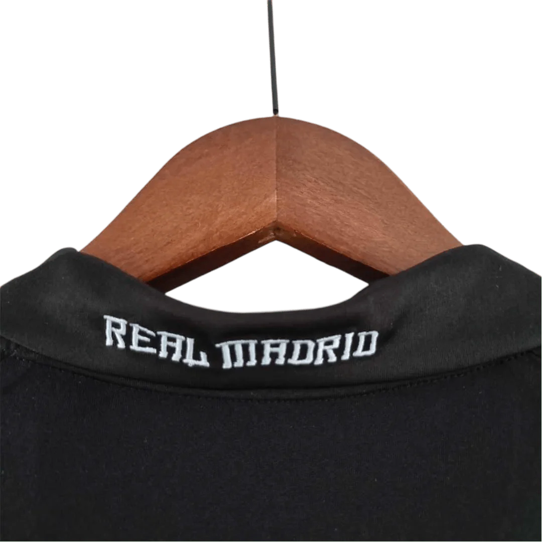 https://cdn.shopify.com/s/files/1/0826/7228/8075/files/20092010-real-madrid-bwin-away-retro-kit-860040.webp?v=1741197447