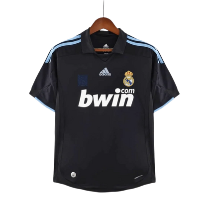 https://cdn.shopify.com/s/files/1/0826/7228/8075/files/20092010-real-madrid-bwin-away-retro-kit-921373.webp?v=1741197446