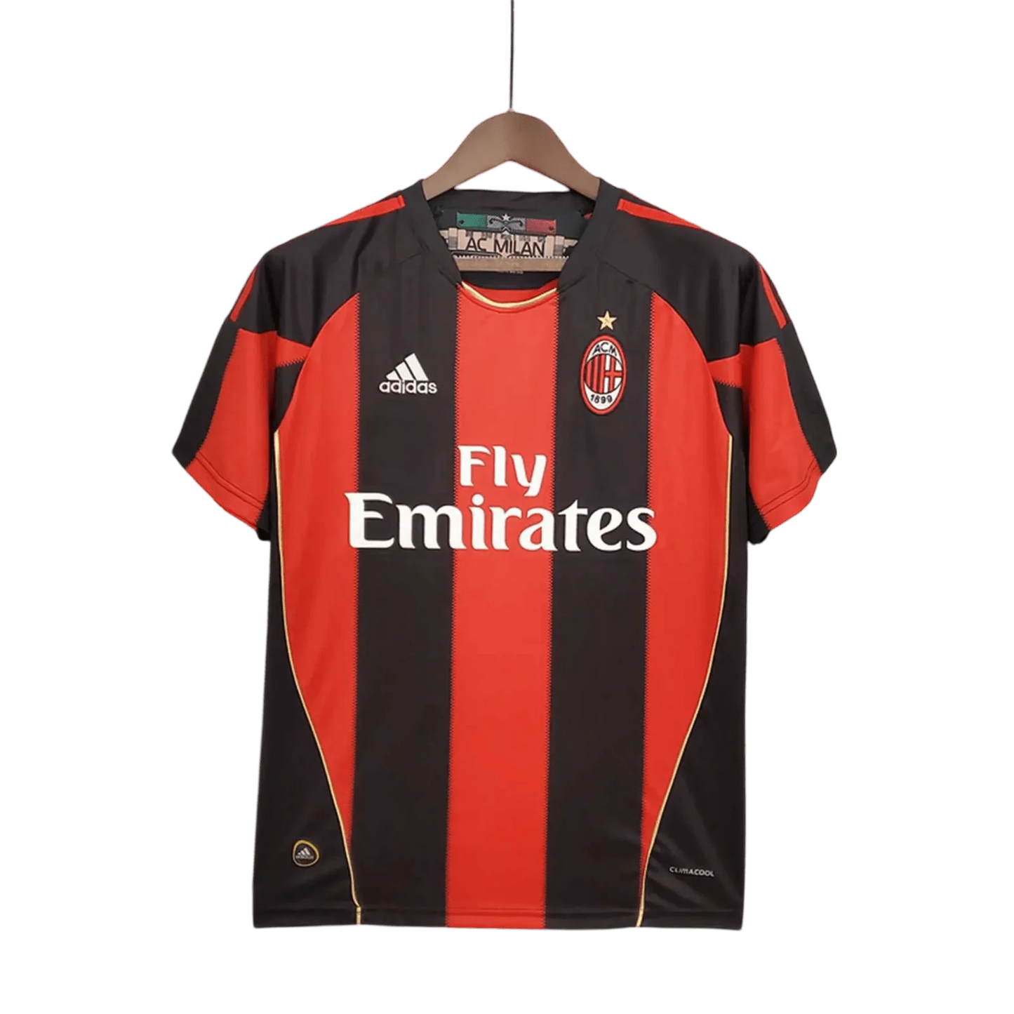 https://cdn.shopify.com/s/files/1/0826/7228/8075/files/20102011-ac-milan-fly-emirates-home-retro-kit-176147.webp?v=1741197283