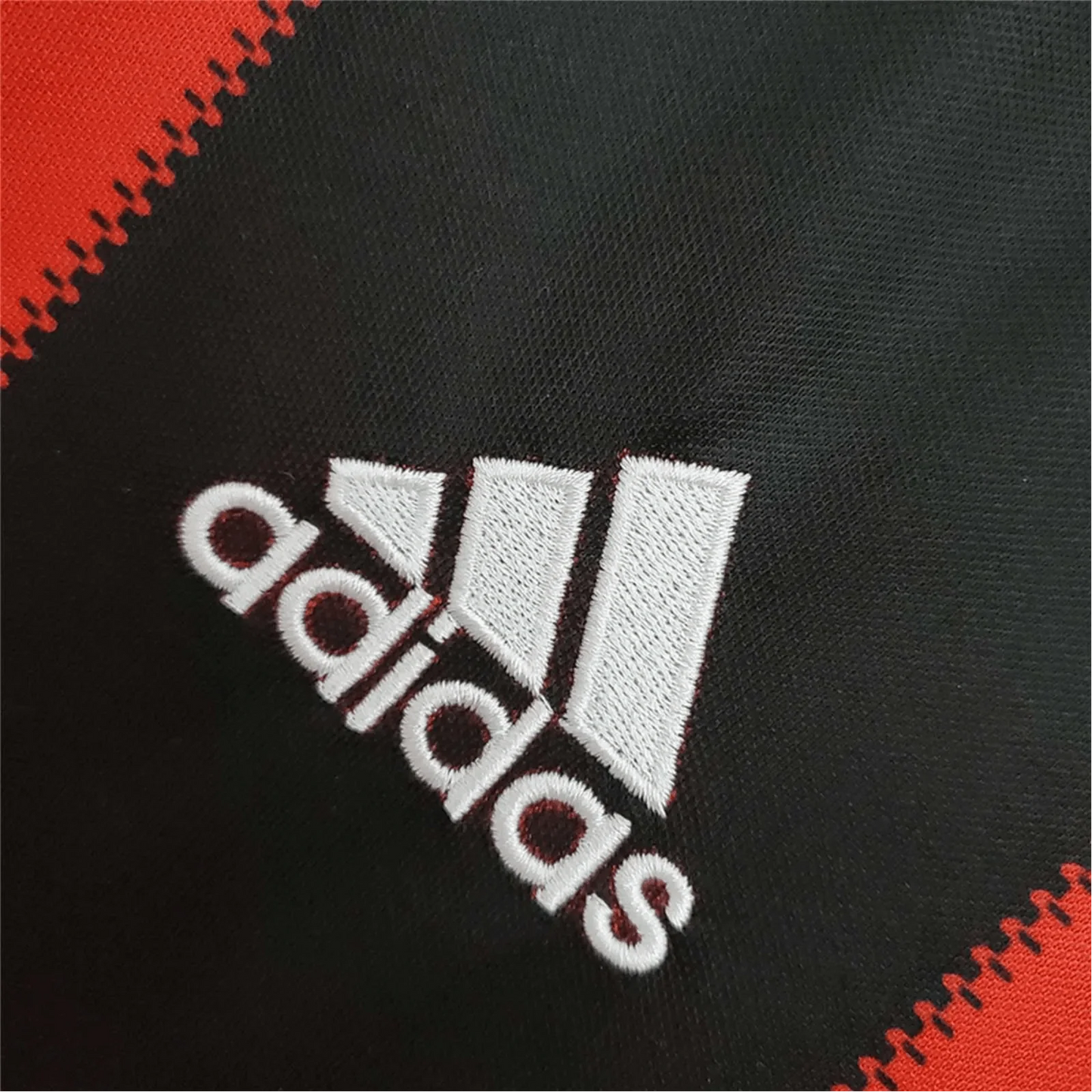 https://cdn.shopify.com/s/files/1/0826/7228/8075/files/20102011-ac-milan-fly-emirates-home-retro-kit-385322.webp?v=1741197285