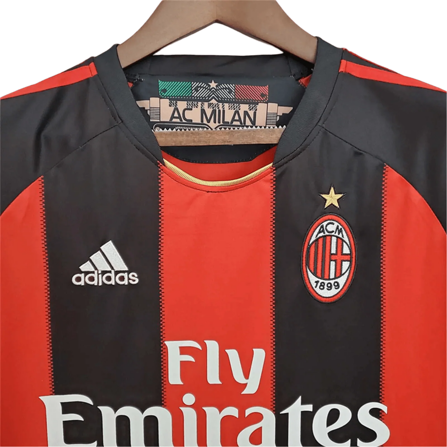 https://cdn.shopify.com/s/files/1/0826/7228/8075/files/20102011-ac-milan-fly-emirates-home-retro-kit-464288.webp?v=1741197286