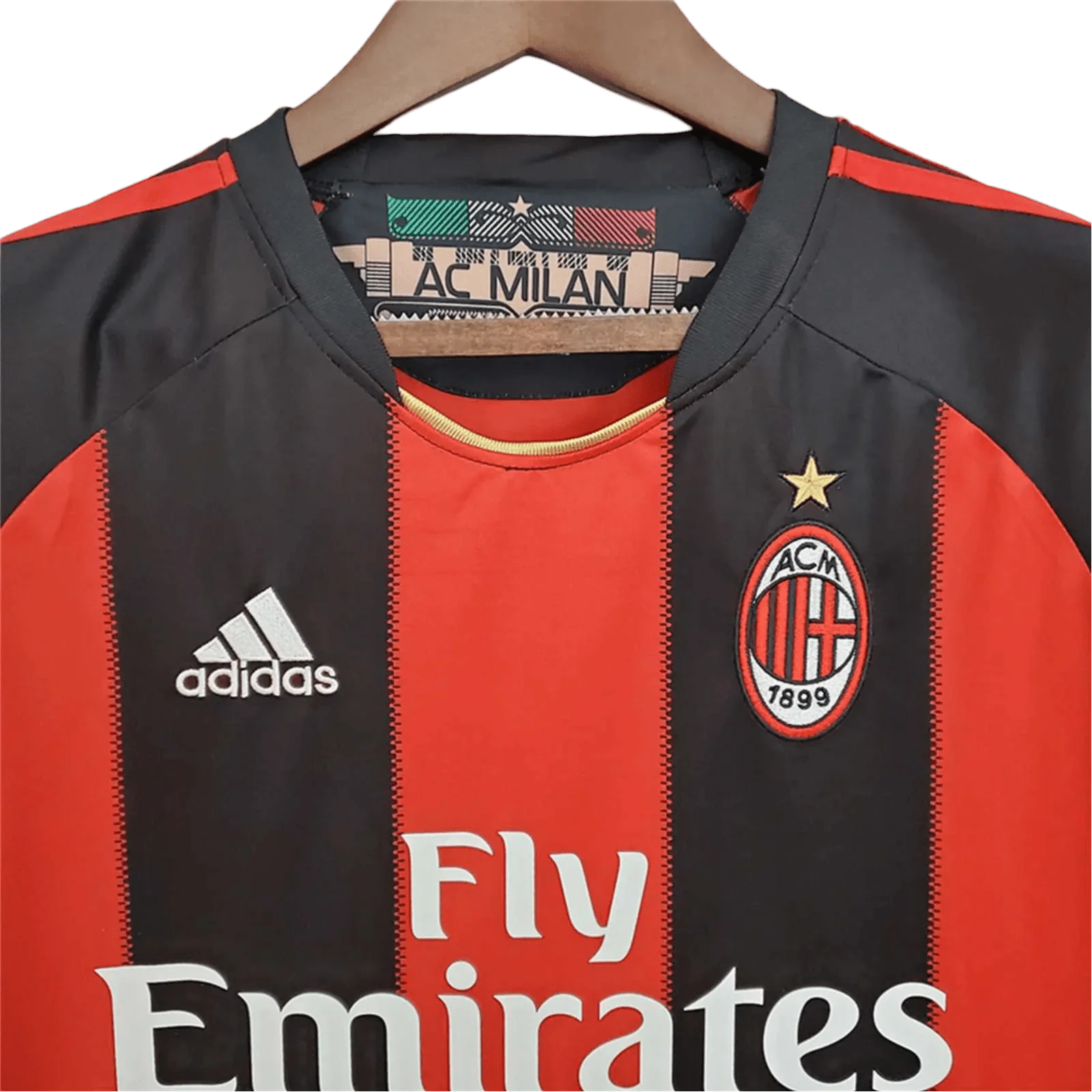 https://cdn.shopify.com/s/files/1/0826/7228/8075/files/20102011-ac-milan-fly-emirates-home-retro-kit-464288.webp?v=1741197286