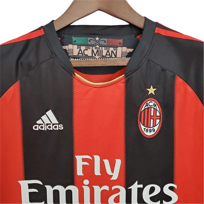 https://cdn.shopify.com/s/files/1/0826/7228/8075/files/20102011-ac-milan-fly-emirates-home-retro-kit-464288.webp?v=1741197286