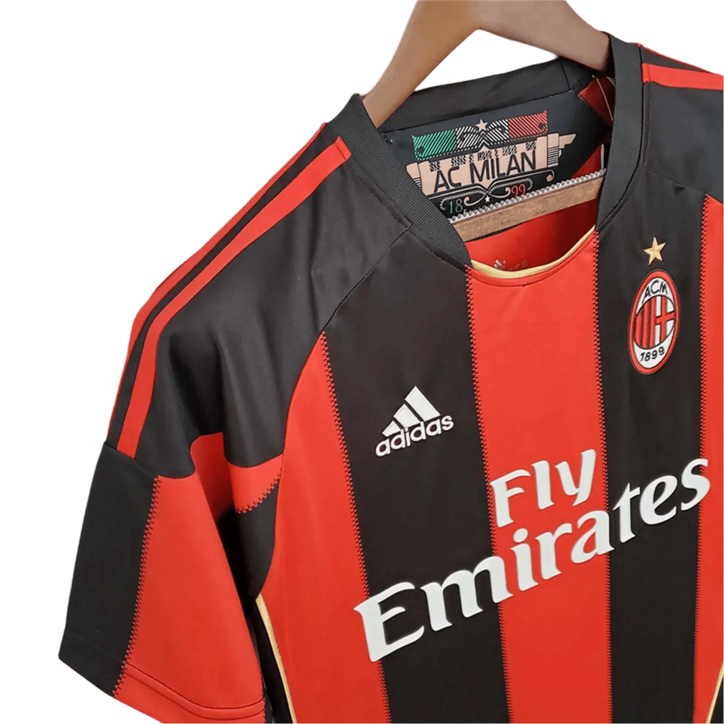 https://cdn.shopify.com/s/files/1/0826/7228/8075/files/20102011-ac-milan-fly-emirates-home-retro-kit-834800.webp?v=1741197282
