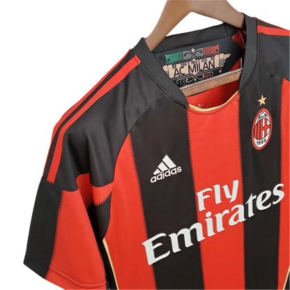 https://cdn.shopify.com/s/files/1/0826/7228/8075/files/20102011-ac-milan-fly-emirates-home-retro-kit-834800.webp?v=1741197282
