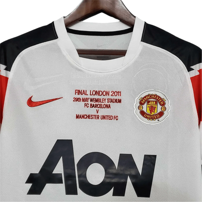 https://cdn.shopify.com/s/files/1/0826/7228/8075/files/20102011-manchester-united-aon-away-retro-kit-classickits433-910570.webp?v=1741197672