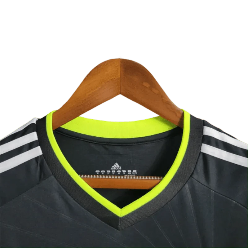 https://cdn.shopify.com/s/files/1/0826/7228/8075/files/20102011-real-madrid-bwin-away-retro-kit-143811.webp?v=1741197269