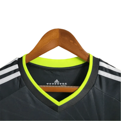 https://cdn.shopify.com/s/files/1/0826/7228/8075/files/20102011-real-madrid-bwin-away-retro-kit-143811.webp?v=1741197269