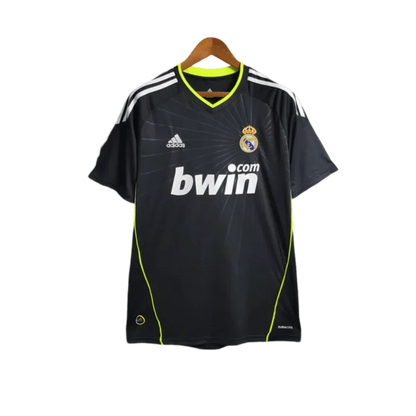 https://cdn.shopify.com/s/files/1/0826/7228/8075/files/20102011-real-madrid-bwin-away-retro-kit-523114.webp?v=1741197270