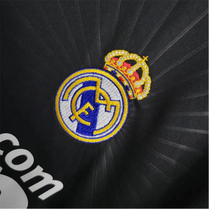 https://cdn.shopify.com/s/files/1/0826/7228/8075/files/20102011-real-madrid-bwin-away-retro-kit-572788.webp?v=1741197269