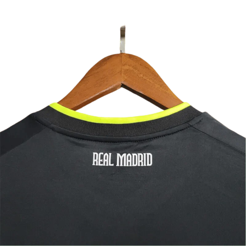 https://cdn.shopify.com/s/files/1/0826/7228/8075/files/20102011-real-madrid-bwin-away-retro-kit-670256.webp?v=1741197268