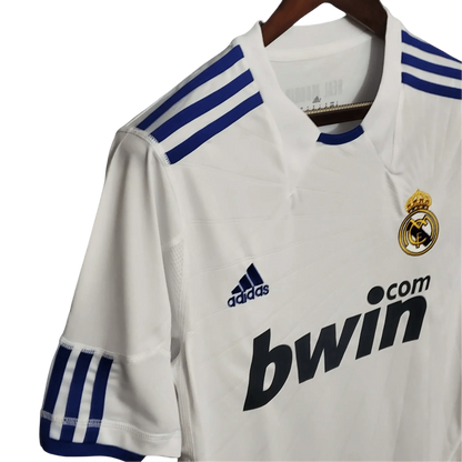 https://cdn.shopify.com/s/files/1/0826/7228/8075/files/20102011-real-madrid-bwin-home-retro-kit-102416.webp?v=1741197460