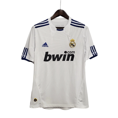 https://cdn.shopify.com/s/files/1/0826/7228/8075/files/20102011-real-madrid-bwin-home-retro-kit-268173.webp?v=1741197462