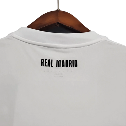 https://cdn.shopify.com/s/files/1/0826/7228/8075/files/20102011-real-madrid-bwin-home-retro-kit-637776.webp?v=1741197459