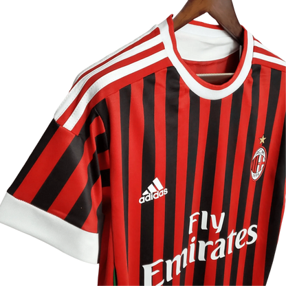 https://cdn.shopify.com/s/files/1/0826/7228/8075/files/20112012-ac-milan-fly-emirates-home-retro-kit-227098.webp?v=1741197296